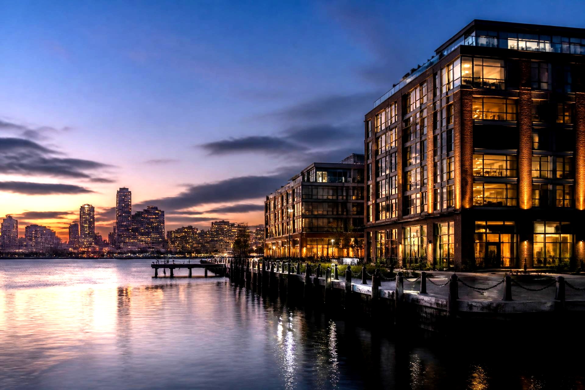 Waterfront commercial development along the Boston harbor at dusk